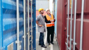Workers-looking-at-some-shipping-containers